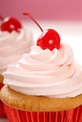 Image showing Vanilla cupcake with maraschino frosting and cherry