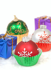 Image showing Christmas ornaments in cupcake liners with gifts