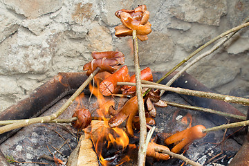 Image showing outdoor grilling sausages