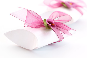 Image showing Small gift box decorated with ribbon