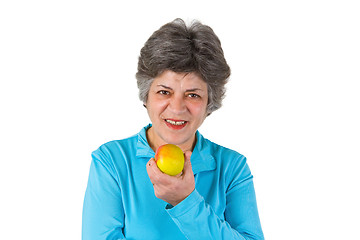 Image showing Senior woman eating apple