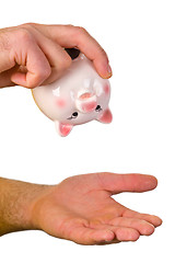 Image showing Hand hold an empty piggy bank