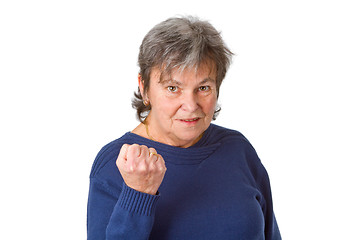 Image showing Female senior with clenched fist