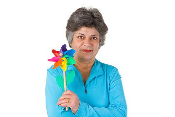 Image showing Female senior holding windmill 