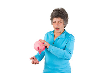 Image showing Senior woman with empty piggy bank