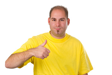 Image showing Casual young man showing thumb up