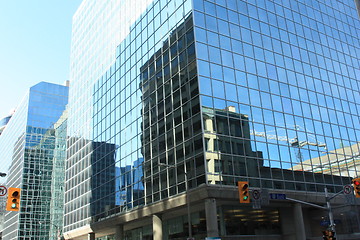 Image showing Tower crane reflected on a building with light green glass, Queen St. 