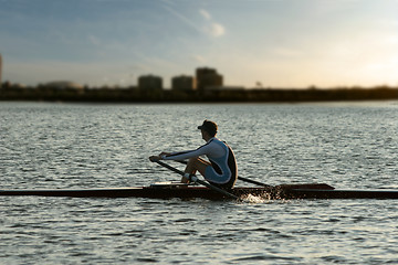 Image showing Rowing alone at sunset