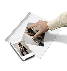 Image showing closeup of hand touching screen on futuristic tablet