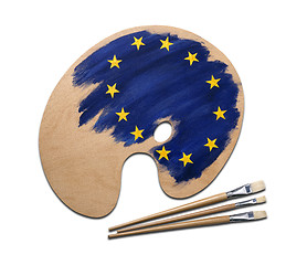 Image showing wooden artists palette loaded with european flag paints and brus