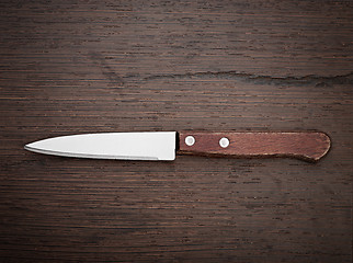 Image showing Knife on rustic kitchen table 