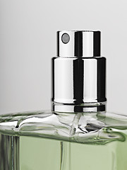 Image showing bottle spray perfume against gray background