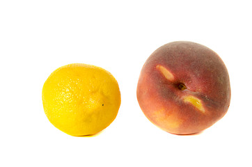 Image showing lemon and peach isolated on white background 