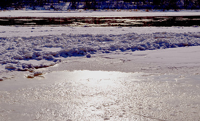 Image showing frozen but still flow river floe snow water 