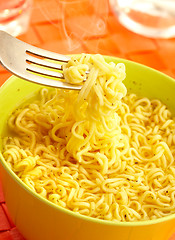 Image showing Hot and tasty noodles on a plug.