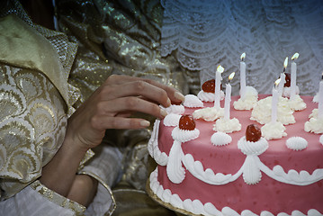 Image showing Woman Touching her Birthday Cake