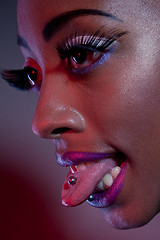 Image showing African Woman With Tongue Piercing