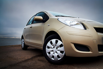 Image showing Front-side closeup of a beige car
