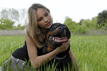 Image showing rottweiler and teenager