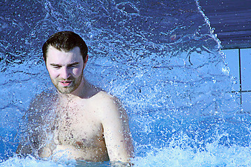 Image showing man relaxing in water