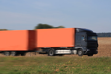 Image showing Red truck on the asphalt 