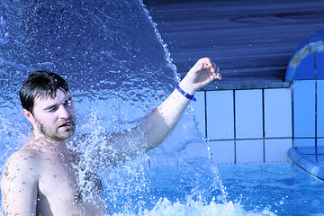 Image showing water splash on man face  