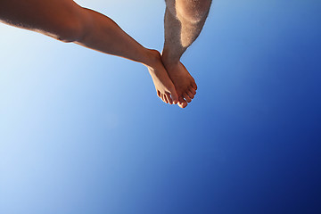 Image showing beautiful feet of man and woman