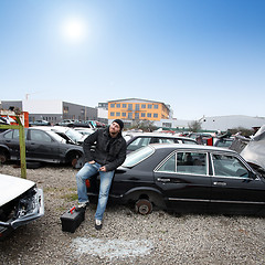 Image showing man looking for car parts