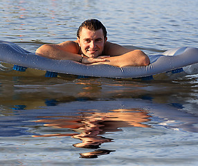 Image showing man air mattress in the lake