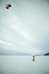 Image showing Flying a kite in winter