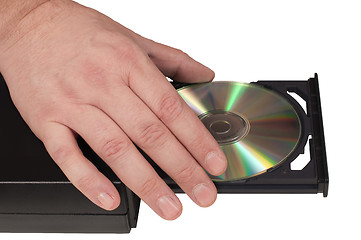 Image showing Hand placing a CD in a drive tray (2/3)