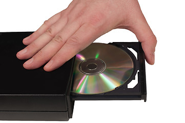 Image showing Hand placing a CD in a drive tray (3/3)