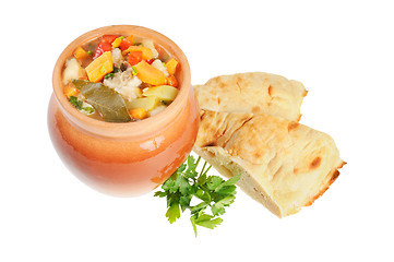 Image showing Roast in a pot and pita bread