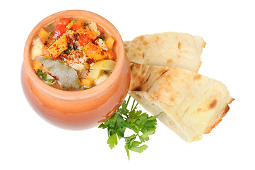 Image showing Roast in a pot and pita bread