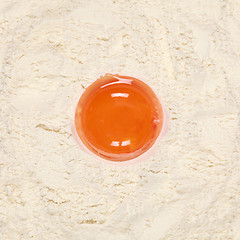 Image showing Egg yolk on flour