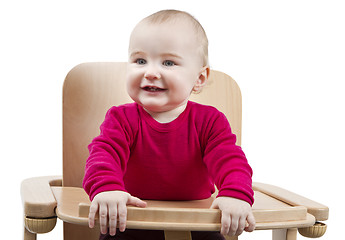 Image showing young child sitting in high chair