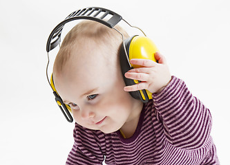 Image showing young child with ear protector