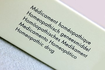 Image showing polyglot homeopathic drug packaging