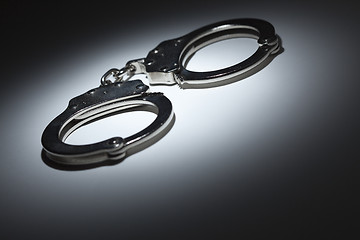 Image showing Abstract Pair of Handcuffs Under Spot Light - Text Room