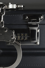 Image showing Pair of Handcuffs on Briefcase with 911 on Lock