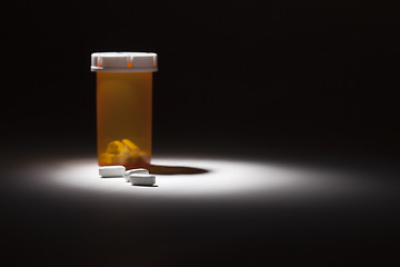 Image showing Medicine Bottle and Pills Under Spot Light