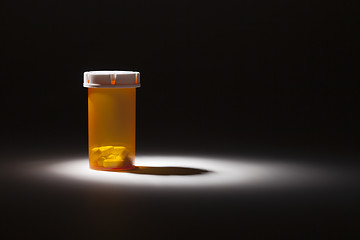 Image showing Medicine Bottle and Pills Under Spot Light