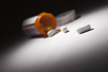 Image showing Medicine Bottle and Pills Under Spot Light