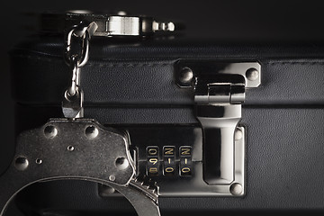 Image showing Pair of Handcuffs on Briefcase with 911 on Lock