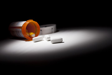 Image showing Medicine Bottle and Pills Under Spot Light