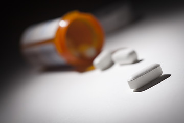 Image showing Medicine Bottle and Pills Under Spot Light