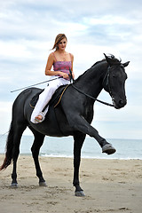 Image showing girl and  horse on the beach