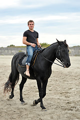 Image showing young man and horse