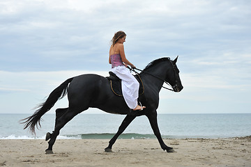 Image showing woman and  horse on the beach