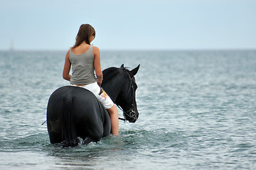 Image showing horseback riding in the sea